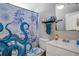 Clean bathroom with nautical-themed shower curtain at 1133 N Brunnell Pkwy, Lakeland, FL 33805