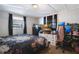 Spacious bedroom with large bed, TV, and workspace at 1133 N Brunnell Pkwy, Lakeland, FL 33805