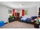 Bedroom with twin bed, dresser, and TV at 1133 N Brunnell Pkwy, Lakeland, FL 33805