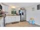 Bright kitchen featuring white cabinets and granite countertops at 1133 N Brunnell Pkwy, Lakeland, FL 33805
