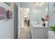 Bathroom with single sink vanity and view of kitchen at 138 Brandy Chase Blvd, Winter Haven, FL 33880