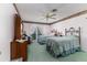 Bedroom featuring two beds with gold frames and a window at 1452 Grand Cayman Cir, Winter Haven, FL 33884