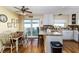 Bright kitchen featuring granite countertops, white cabinetry, stainless steel appliances and an eat-in kitchen area at 1452 Grand Cayman Cir, Winter Haven, FL 33884