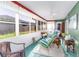 Screened in lanai with tile floors and ceiling fan at 1452 Grand Cayman Cir, Winter Haven, FL 33884