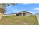 Large backyard with grassy area and fence at 1570 Doves View Cir, Auburndale, FL 33823