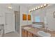 Bathroom boasts double sinks, a soaking tub and shower at 1570 Doves View Cir, Auburndale, FL 33823