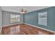 Spacious bedroom with wood floors and ceiling fan at 1570 Doves View Cir, Auburndale, FL 33823