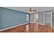 Bright bedroom with wood floors and ensuite bathroom at 1570 Doves View Cir, Auburndale, FL 33823