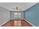 Bedroom featuring wood floors and a window with natural light at 1570 Doves View Cir, Auburndale, FL 33823