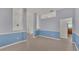 Bright dining room with blue and gray walls and tile floor at 1570 Doves View Cir, Auburndale, FL 33823