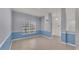 Spacious dining room with blue and gray walls and tile floor at 1570 Doves View Cir, Auburndale, FL 33823