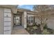 Front entry with walkway, landscaping, and glass door at 1570 Doves View Cir, Auburndale, FL 33823