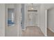 Bright and airy foyer with tiled floor and neutral colors at 1570 Doves View Cir, Auburndale, FL 33823