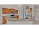 Kitchen with wood cabinets, stainless steel appliances and island at 1570 Doves View Cir, Auburndale, FL 33823