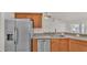 Stainless steel appliances and wood cabinets in kitchen at 1570 Doves View Cir, Auburndale, FL 33823