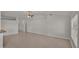 Open concept living area with neutral colors and tile floors at 1570 Doves View Cir, Auburndale, FL 33823
