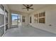 Screened porch with ceiling fan and backyard view at 1570 Doves View Cir, Auburndale, FL 33823