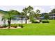 Inviting community pool with lush landscaping at 1600 W Lake Parker Dr # B7, Lakeland, FL 33805