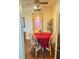 Dining area with a round table, chairs, and access to the kitchen and bathroom at 1600 W Lake Parker Dr # B7, Lakeland, FL 33805