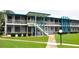 Building exterior showcasing mid-century modern architecture with a walkway and landscaping at 1600 W Lake Parker Dr # B7, Lakeland, FL 33805