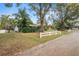 Single story home with a large yard and mature trees at 1628 Lakewood S Dr, Lakeland, FL 33813