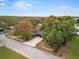 Aerial view of a single-story house with a large yard and trees at 1628 Lakewood S Dr, Lakeland, FL 33813