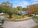 Aerial view of a single-story home with a spacious yard and trees at 1628 Lakewood S Dr, Lakeland, FL 33813