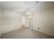 Bedroom with ceiling fan, carpet, and mirrored closet doors at 1628 Lakewood S Dr, Lakeland, FL 33813