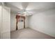 Spacious bedroom with ceiling fan and carpet flooring at 1628 Lakewood S Dr, Lakeland, FL 33813