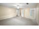 Bright bedroom with access to bathroom and hallway at 1628 Lakewood S Dr, Lakeland, FL 33813