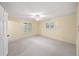 Spacious bedroom with ceiling fan and window shutters at 1628 Lakewood S Dr, Lakeland, FL 33813