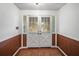 Bright entryway with double doors and terracotta tile floor at 1628 Lakewood S Dr, Lakeland, FL 33813
