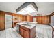 View of kitchen island, sink, and stainless steel dishwasher at 1628 Lakewood S Dr, Lakeland, FL 33813