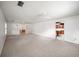 Large living area, open to kitchen, carpeted throughout at 1628 Lakewood S Dr, Lakeland, FL 33813