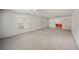 Spacious living room with neutral carpeting and ceiling fan at 1628 Lakewood S Dr, Lakeland, FL 33813