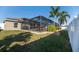 Screened pool and patio area with nicely landscaped yard at 1695 Doves View Cir, Auburndale, FL 33823