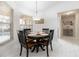 Charming breakfast nook with a wood table and four black chairs at 1695 Doves View Cir, Auburndale, FL 33823