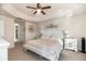 Main bedroom with king-size bed and ensuite bathroom access at 1695 Doves View Cir, Auburndale, FL 33823