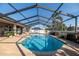 Inviting pool area with screened enclosure and spacious patio at 1695 Doves View Cir, Auburndale, FL 33823