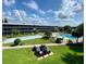 Aerial view of the community, showcasing pool and lawn at 1700 6Th Nw St # C27, Winter Haven, FL 33881