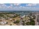 Aerial view showcasing a city landscape with lakes and various buildings at 1700 6Th Nw St # C27, Winter Haven, FL 33881