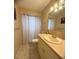 Clean bathroom with shower/tub combo, vanity, and updated fixtures at 1700 6Th Nw St # C27, Winter Haven, FL 33881