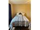 Cozy bedroom with a double bed and neutral-colored bedding at 1700 6Th Nw St # C27, Winter Haven, FL 33881