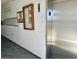 Building hallway with elevator access and mailboxes at 1700 6Th Nw St # C27, Winter Haven, FL 33881