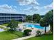 Refreshing community pool with patio furniture at 1700 6Th Nw St # C27, Winter Haven, FL 33881