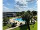 Relaxing community pool area with patio furniture at 1700 6Th Nw St # C27, Winter Haven, FL 33881