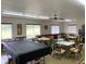 Community room offering a pool table and seating areas at 1700 6Th Nw St # C27, Winter Haven, FL 33881