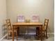 Small dining area with wooden table and chairs at 1700 6Th Nw St # C27, Winter Haven, FL 33881