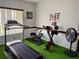 Exercise room featuring a treadmill, exercise bike, and stepper at 1700 6Th Nw St # C27, Winter Haven, FL 33881