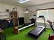 Exercise room with treadmill, Pilates reformer, and stationary bike at 1700 6Th Nw St # C27, Winter Haven, FL 33881